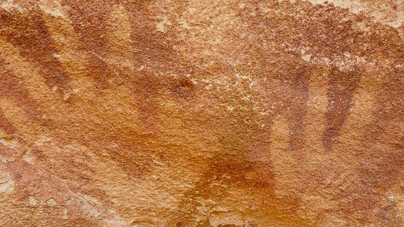 Unveiling the Mystery: What Tiny Hand Stencils in Ancient Cave Art Really Represent