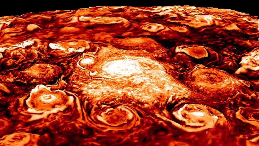 Unveiling Jupiter s Hidden Storms: Massive Cyclones and Powerful Jets Beneath the Cloud Layers