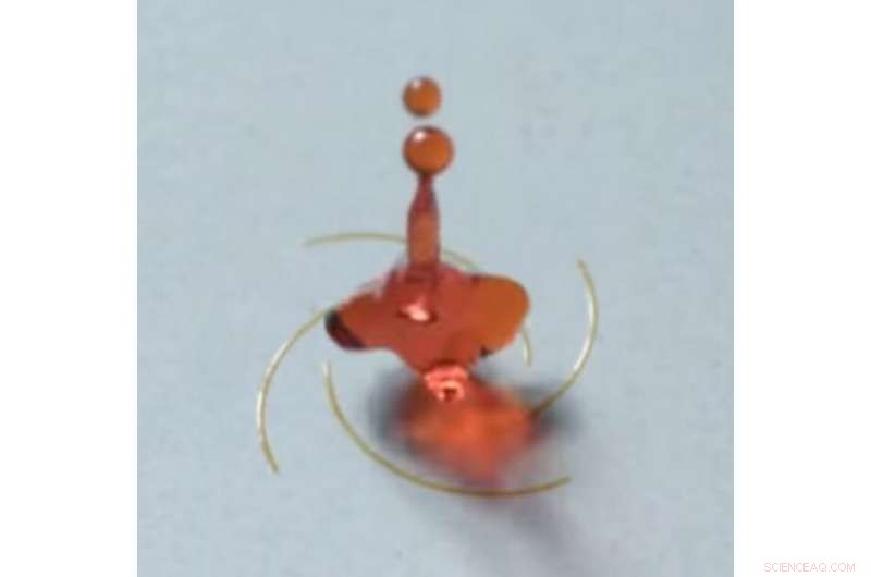 Engineered Surfaces Cause Droplets to Spin on Rebound