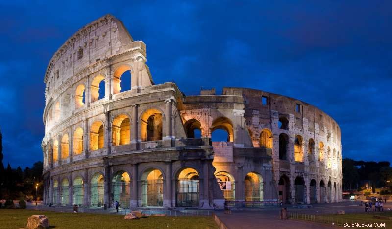 Roman Colosseums as Unintentional Seismic Wave Cloaks: Revisiting Historical Architecture