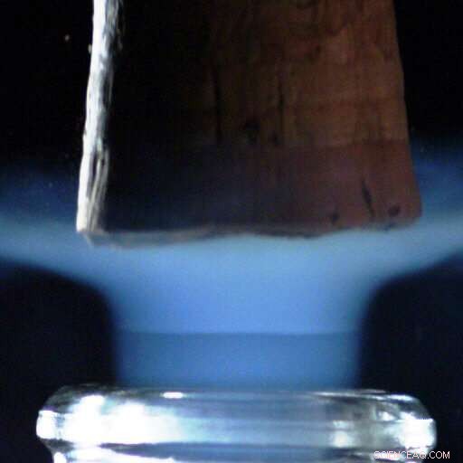 Champagne Cork Release Generates High-Speed CO₂ Freezing Jets