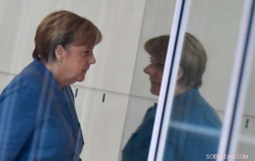 Merkel Faces Criticism Over Coal and Auto Policies Amid Climate Agenda