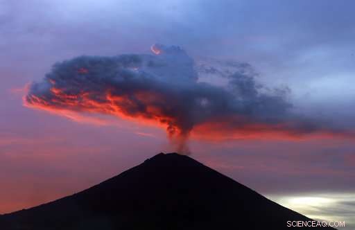 Mass Exodus Amid Mount Agung Eruption: Some Evacuate, Others Stay or Seek the Volcano