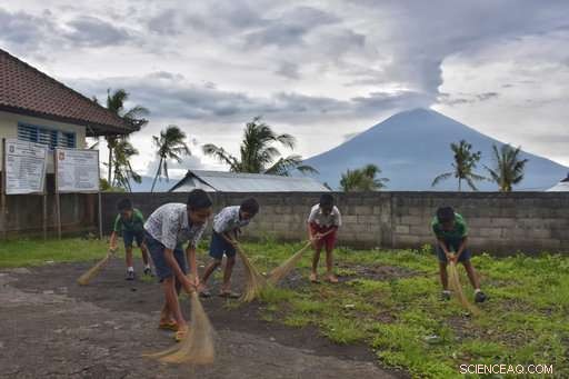 Mass Exodus Amid Mount Agung Eruption: Some Evacuate, Others Stay or Seek the Volcano