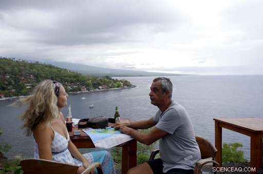 Mass Exodus Amid Mount Agung Eruption: Some Evacuate, Others Stay or Seek the Volcano