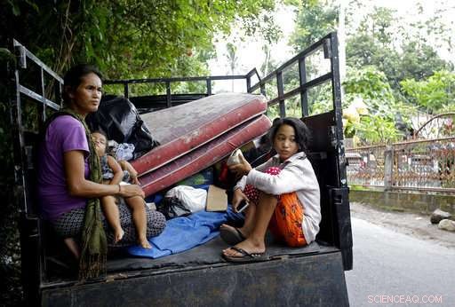 Mass Exodus Amid Mount Agung Eruption: Some Evacuate, Others Stay or Seek the Volcano