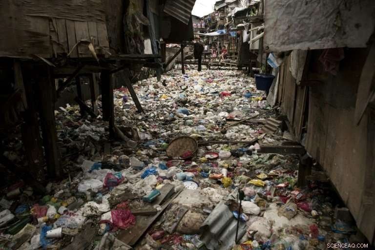 Plastic Pollution Saturates Manila Slum Waterway, Threatening Residents  Health