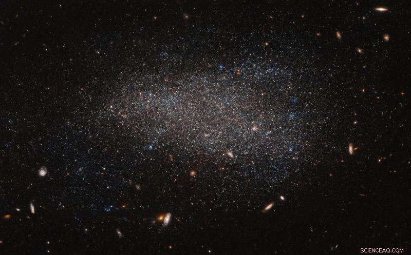 Hubble Captures Subtle Swarm Around Dwarf Galaxy NGC 4789A