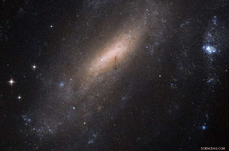 Hubble Telescopes Zoom In on Spiral Galaxy IC 5201