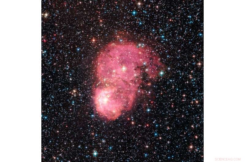 Bright Nebula Illuminates the Small Magellanic Cloud, a Milky Way Satellite
