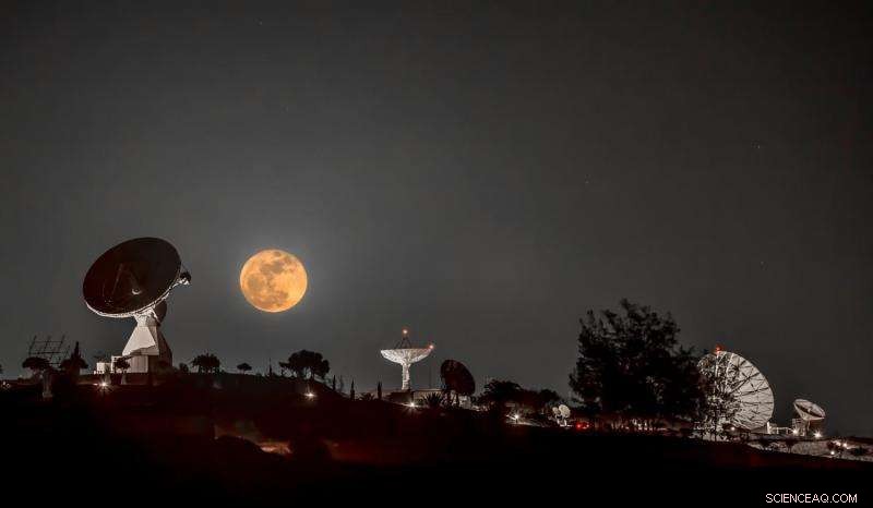 Winter Moon: Full Moon Over INTA Satellite Dishes