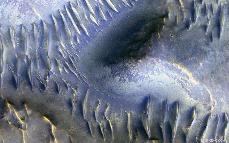 Mars MRO Image Captures Dunes Splitting Around a Mound