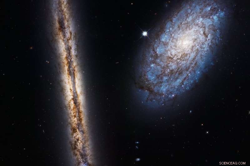 Hubble Celebrates 27 Years in Orbit, Capturing Stunning Images of NGC 4302 and NGC 4298