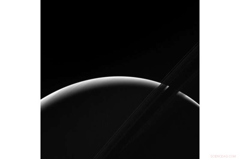 Cassini Captures Saturnian Dawn: Stunning View of Sunlit Atmosphere and Icy Rings