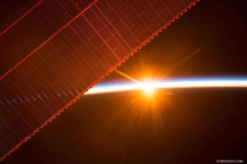 Capturing Dawn: Sunrise Through ISS Solar Panels