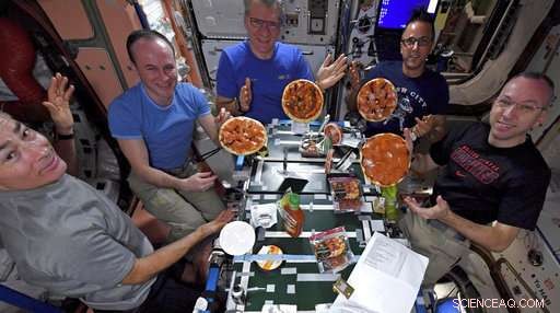 Astronauts Prepare, Toss, and Enjoy Homemade Pizza on the International Space Station