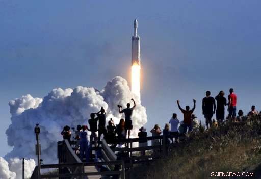 SpaceX Launches Falcon Heavy, Sending a Sports Car into Space