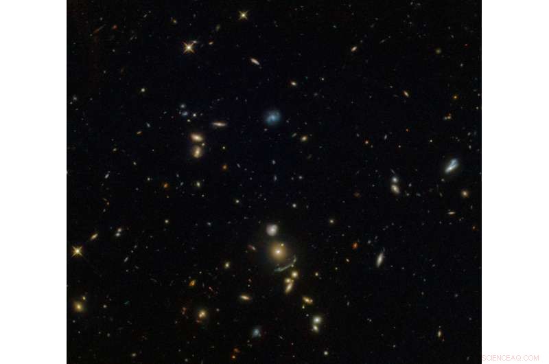 Hubble Telescope Reveals Stunning Green Cosmic Arc in Distant Galaxy Cluster