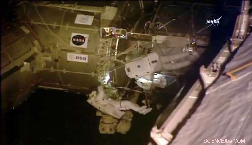 Astronauts Install TV Cameras During Spacewalk to Monitor Incoming Spacecraft