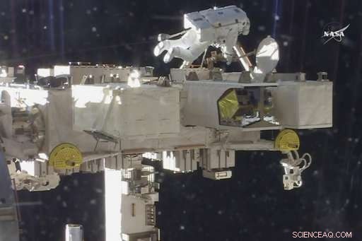 Astronauts Install TV Cameras During Spacewalk to Monitor Incoming Spacecraft