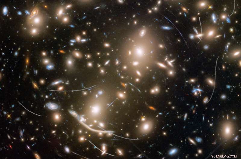 Hubble Reveals Asteroid Dance Amid Distant Galaxies