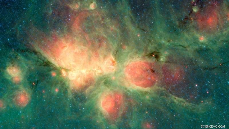 Newborn Stars Create Bubble Nebula: Stunning Spitzer Image of the Cat s Paw Nebula