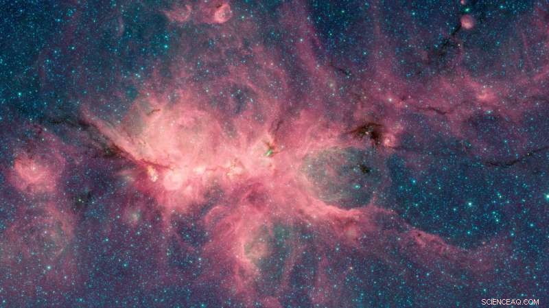 Newborn Stars Create Bubble Nebula: Stunning Spitzer Image of the Cat s Paw Nebula
