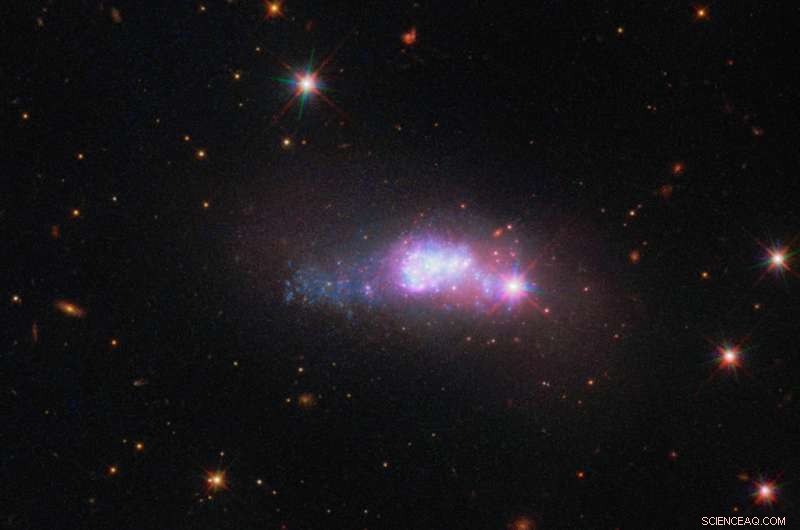 Hubble Captures Lone Blue Dwarf Galaxy 100 Million Light-Years Away