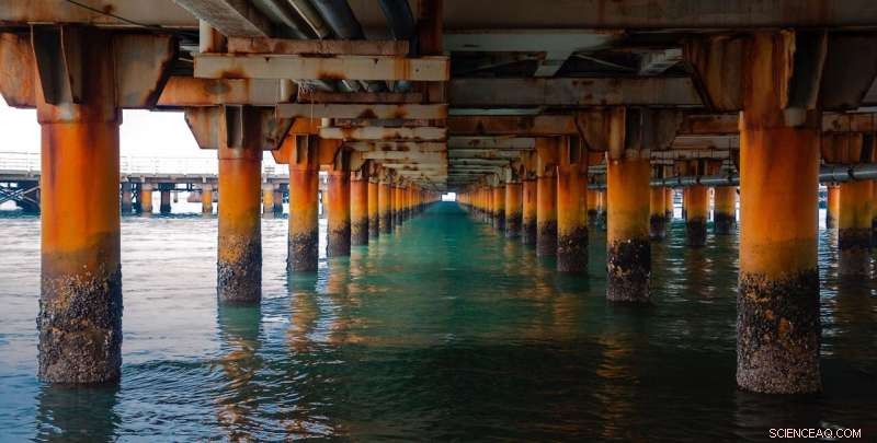 Thin Rust Layers Generate Clean Power from Flowing Water