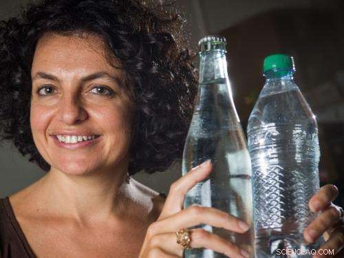 How Container Material Properties Influence Water Viscosity at the Nanoscale