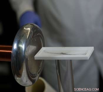Reconfigured Tesla Coil Enables Long-Range Alignment and Electrification of Materials