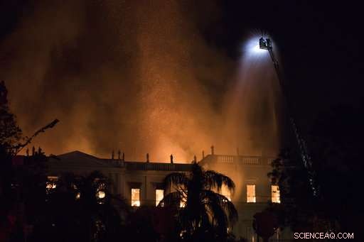 Firefighters battle to preserve priceless artifacts as Rio s National Museum burns