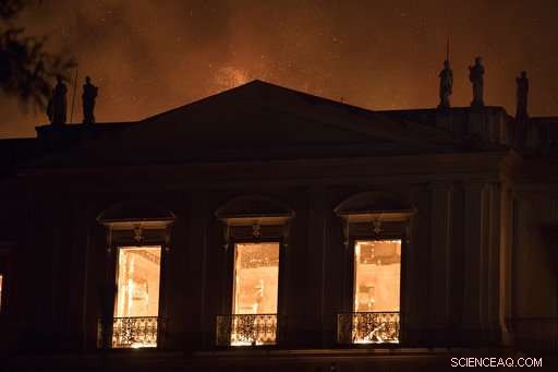 Firefighters battle to preserve priceless artifacts as Rio s National Museum burns