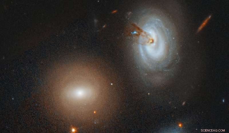 Spiral Galaxy D100 Stripped of Gas as It Falls into Coma Cluster