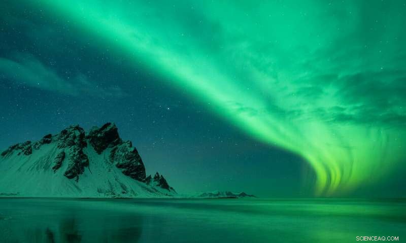 Solar Storm Illuminates Iceland: Stunning Night Sky Photo by Ollie Taylor