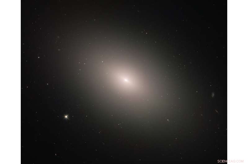 Hubble Captures Messier 59: A Galaxy Defying Conventional Growth Patterns