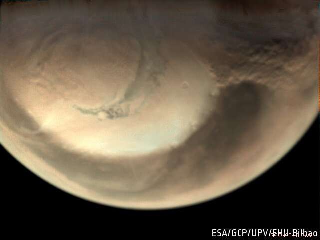 Mars Express Captures Dust Storm Swirling Over North Polar Ice Cap
