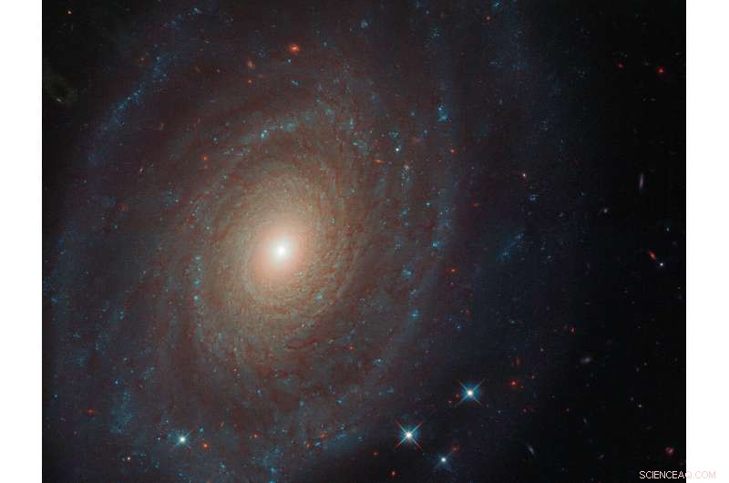 Hubble Reveals Spiraling Galaxy NGC 691: A Glimpse into Cosmic History