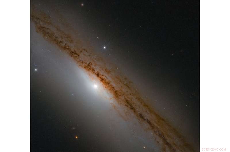 Hubble Space Telescope Investigates Star Consumption in Spiral Galaxy NGC 1589