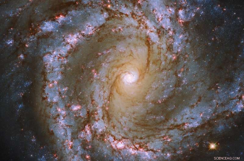 Hubble Captures Stunning Spiral Galaxy M61 in High-Resolution Detail