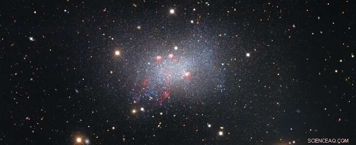 Detailed View of Sextans B Dwarf Galaxy Reveals Star Clusters and Background Galaxies