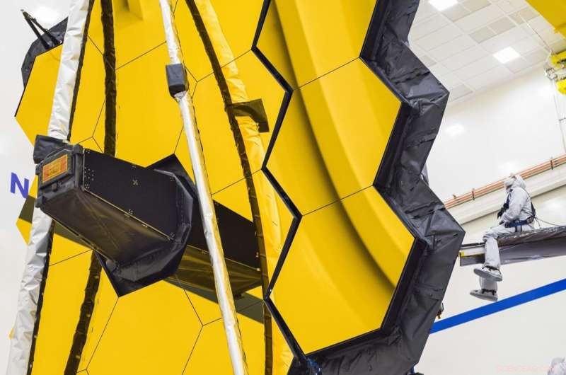 NASA s Webb Telescope Unveils Its Golden Mirror One Final Time on Earth