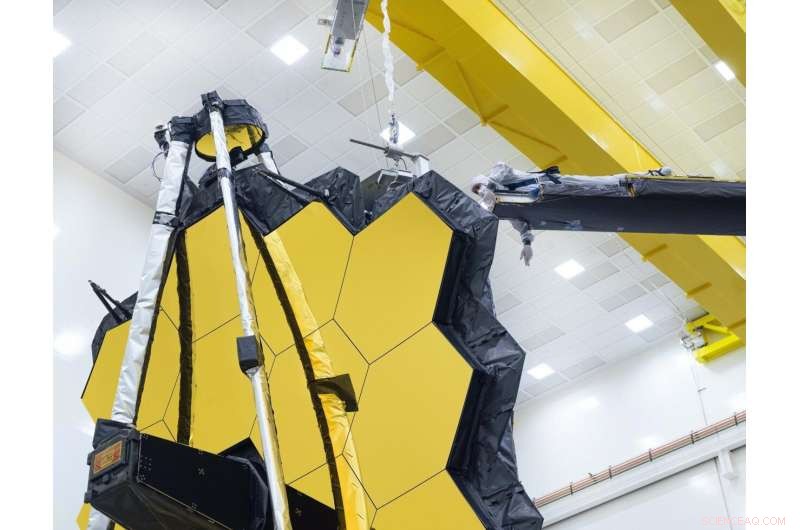 NASA s Webb Telescope Unveils Its Golden Mirror One Final Time on Earth