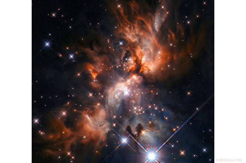 Hubble Captures Stunning View of the Dusty Stellar Nursery AFGL 5180 in Gemini