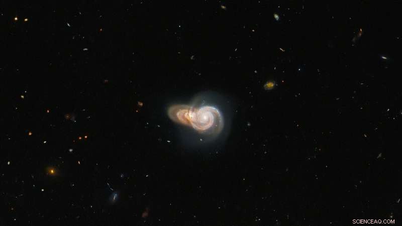 Hubble Reveals Two Overlapping Spiral Galaxies: A Chance Alignment