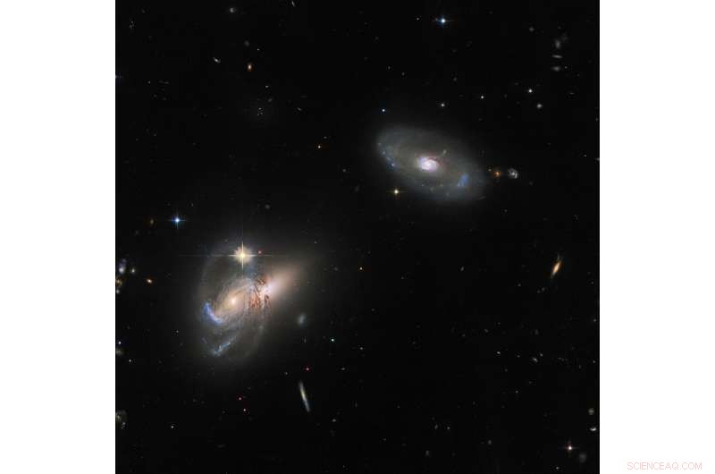Hubble Reveals Complex Interaction Among Three Galaxies