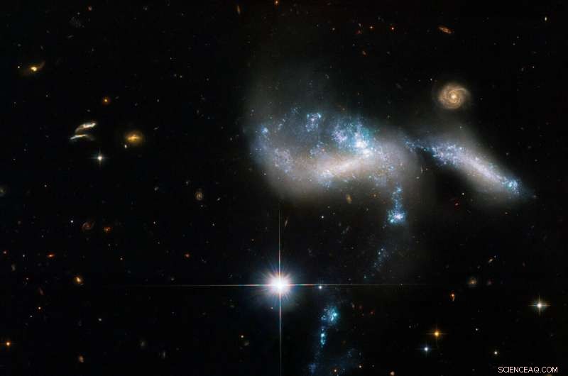 Hubble Unveils Stellar River in Interacting Galaxies of Hickson Compact Group 31