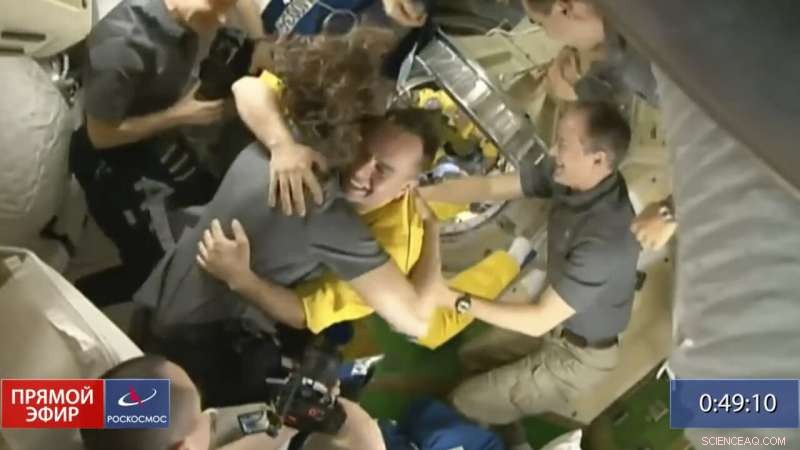 Three Russian Cosmonauts Arrive at the ISS in Yellow-Blue Suits