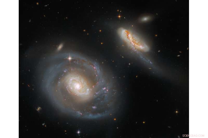 Hubble Captures the Dramatic Interaction of Galaxies Arp 298