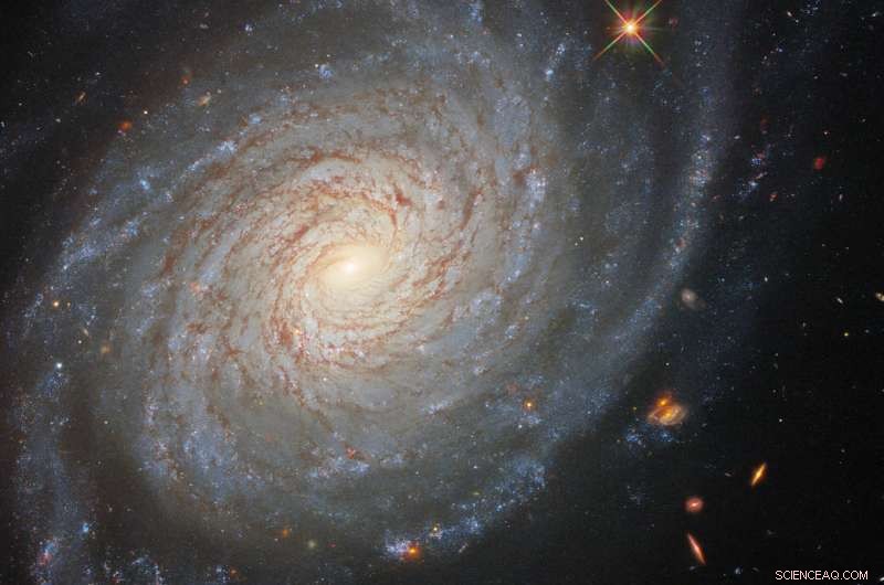 Hubble Reveals Serene Spiral Galaxy with a Turbulent Past